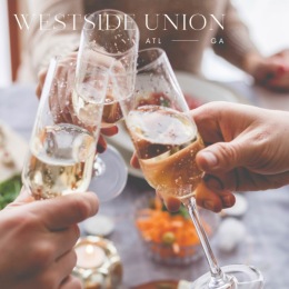 a few people holding their drink glasses together