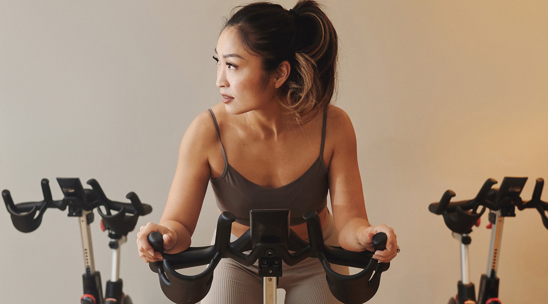 Cutting-edge amenities at your fingertips woman on exercise equiptment